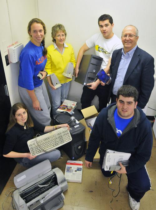 Professor William Bullock and members of the design seminar pose with some equipment used as part of their Industrial Design course on sustainable e-waste. Erica Magda
