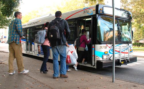 Riders board an MTD bus at the Illini Union stop Sunday. The University is currently working with MTD to improve bus congestion along Wright Street in order to enhance pedestrian safety. Brennan Caughron
