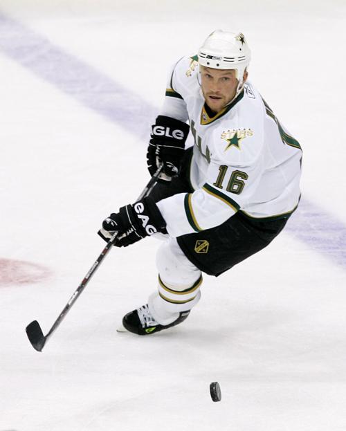 Dallas Stars center Sean Avery moves the puck during a game against the Chicago Blackhawks in Dallas on Nov. 20. The NHL has suspended Avery pending a hearing with commissioner Gary Bettman. Tony Gutierrez, The Associated Press
