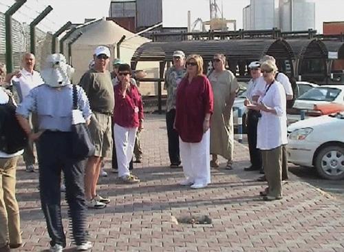 In this image from TV, tourists from the cruise liner M/S Nautica stand at the port in Muscat, Oman, after the vessel docked Wednesday. Six suspected pirates, riding in two skiffs, chased and shot at the Nautica on Sunday as it sailed in the Gulf of Aden. The Associated Press
