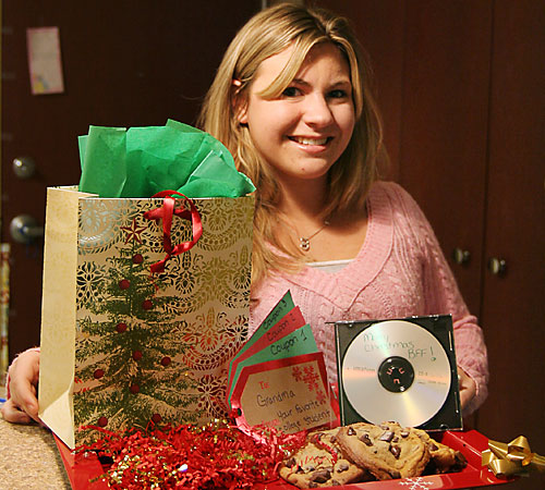 Kristy+Shaulis%2C+a+freshman+in+Media%2C+poses+with+her+inexpensive+homemade+Christmas+presents%2C+including+cookies+for+Dad%2C+coupons+for+Grandma+and+a+mix+CD+for+a+good+friend.+Erica+Magda%0D%0A
