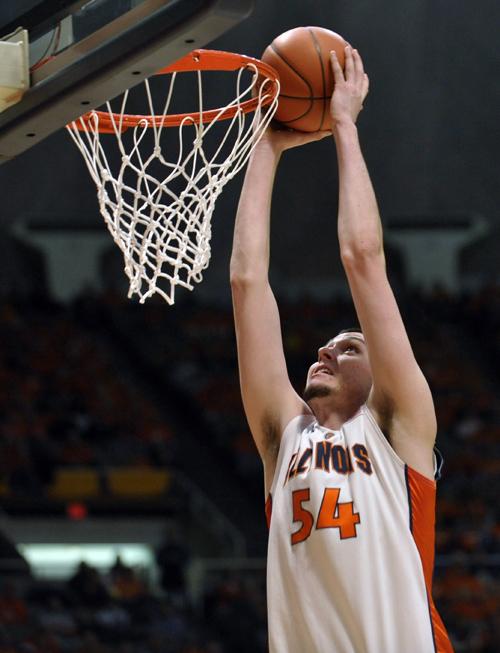 Illinois center Mike Tisdale puts in a dunk during the first half of a NCAA college basketball game Wednesday, Jan. 14, 2009, in Champaign, Ill. (AP Photo/Darrell Hoemann)
