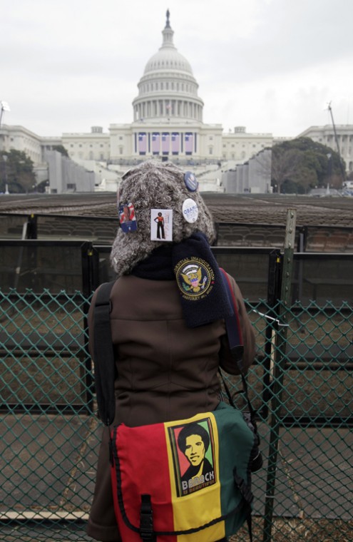 Teri McClain wears buttons and a bag in support of President-elect Barack Obama in front of the Capitol in Washington on Monday, where his swearing-in will take place on Tuesday. Alex Brandon, The Associated Press

