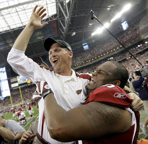 Arizona Cardinals head coach Ken Whisenhunt, left, celebrates with Gabe Watson after the NFC championship game against the Philadelphia Eagles Sunday in Glendale, Ariz. The Cardinals won 32-25, sending the team to the Super Bowl to play the Pittsburgh Ste David J. Phillip, The Associated Press
