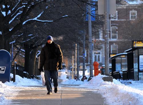Wesley Fane The Daily Illini Shreyas Madhur, junior in Engineering, walks along Wright Street late Thursday afternoon. I just came in yesterday, said Madhur, who transferred from a school in India. Yesterdays temperatures were by far the coldest Madhur had ever felt. I have nothing to compare it to.
