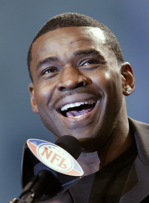 ** FILE ** In this Feb. 3, 2007, file photo, Former Dallas Cowboys wide receiver Michael Irvin smiles after being selected for the Pro Football Hall of Fame during a news conference in Miami, Fla. Irvin is launching a reality TV show in which 12 football neophytes will compete for an impressive grand prize: a spot on the Cowboys training camp roster. (AP Photo/Chris OMeara,file)
