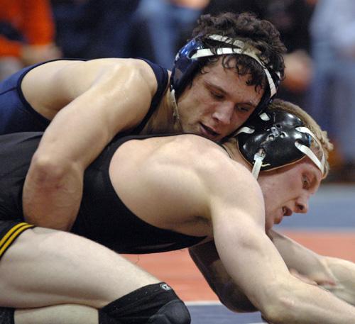 Mike Poeta competes against an Iowa wrestler on Feb. 24, 2008 at Huff Hall. No. 7 Illinois will face No. 1 Iowa this weekend. Erica Magda
