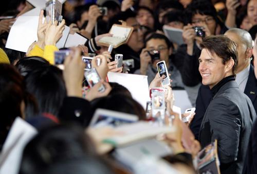 Hollywood star Tom Cruise poses for his fans to take pictures on the red carpet event in Seoul, South Korea, Sunday, Jan. 18, 2009. Lee Jin-man, The Associated Press
