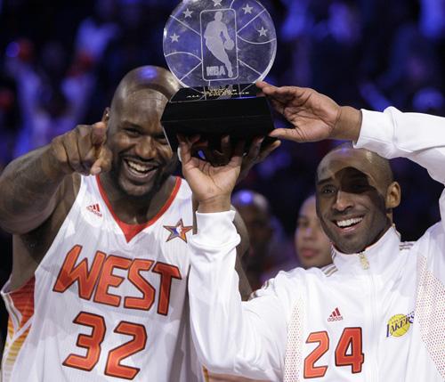Western All-Star Shaquille ONeal (32) of the Phoenix Suns and Western All-Star Kobe Bryant (24) of the Los Angeles Lakers share the MVP award after the NBA All-Star basketball game Sunday, Feb. 15, 2009, in Phoenix. (AP Photo/Ross D. Franklin)
