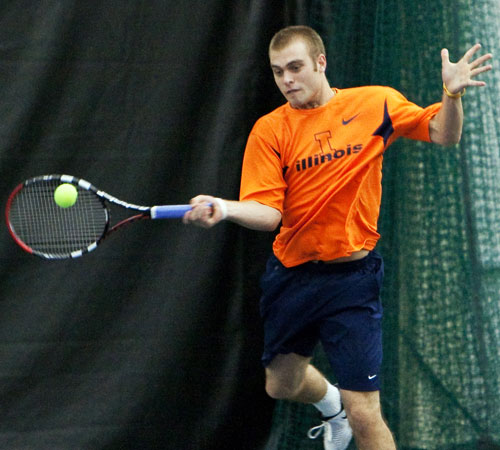 Freshman Dennis Nevolo returns a serve in a doubles match against Tennessee on Saturday at the Atkins Tennis Center. The Illini lost to Tennessee but are heading to Indoor Championships in Chicago. Erica Magda
