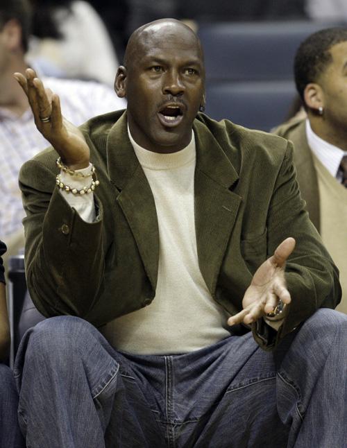 Charlotte Bobcats managing partner Michael Jordan reacts from the sidelines during a Jan. 3 game against the Milwaukee Bucks in Charlotte, N.C. Jordan insists his decisions will result in growth for the team. Chuck Burton, The Associated Press
