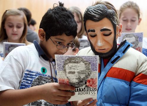 Ankeith Guntupalli, 6, left, of Springfield and Gabriel Benner of Chicago recite the Gettysburg Address during a simultaneous nationwide reading at the Abraham Lincoln Presidential Museum on Thursday. The Associated Press

