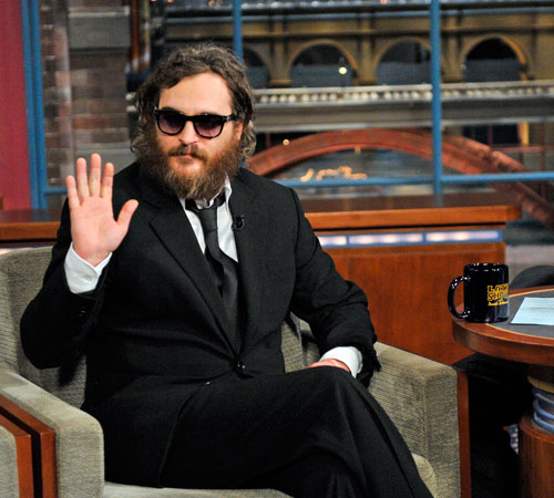 Joaquin Phoenix waves to the audience from The Late Show with David Letterman, in New York on Wednesday. The Associated Press
