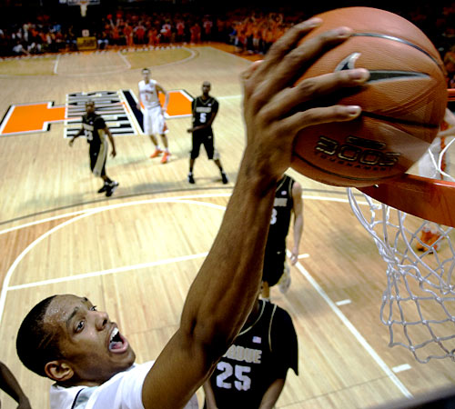 Mike Davis goes for a dunk against Purdue in Assembly Hall on Sunday. Davis ended up with 14 points and 16 rebounds, helping the Illini beat the Boilermakers 66-48. Erica Magda
