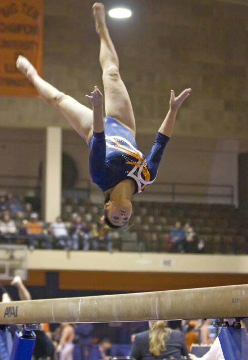 Trevor Greene The Daily Illini Illinois Nicole Cowart competes on the balance beam during the meet against Iowa in Huff Hall on Saturday, January 24th. The Illini fell to the Hawkeyes 194.400 to 194.950.
