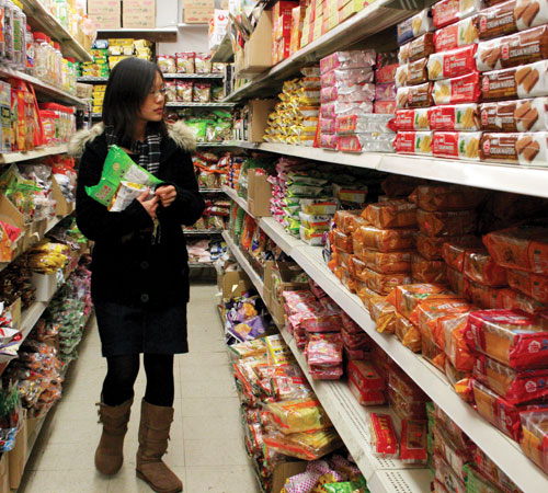 Fangqiong Ling, senior in Engineering, shops at Far East Grocery Store in Champaign on Sunday. The store stocks food from China, Indonesia and Laos. Erica Magda
