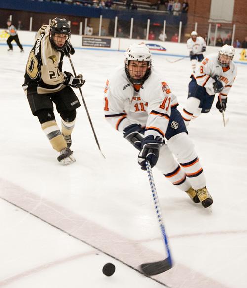 Johnny Chiang The Daily Illini Illinois Lucas Scherer goes for the puck during the Friday showdown against Lindenwood at the Ice Arena on February 13, 2009.
