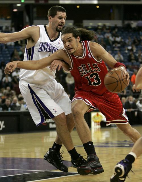 Sacramento Kings center Brad Miller, left, defends against Chicago Bulls center Joakim Noah during the first quarter of a game in Sacramento, Calif., Jan. 30. The Bulls acquired Miller on Wednesday. Rich Pedroncelli, The Associated Press
