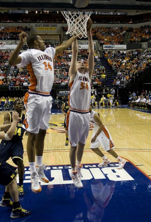 Illinois’ Mike Tisdale (54) and Mike Davis (24) go for a rebound at the Big Ten Tournament against Michigan at Conseco Fieldhouse in Indianapolis, Ind. on Friday. Coach Bruce Weber announced Wednesday night that Chester Frazier will not play this weekend.
