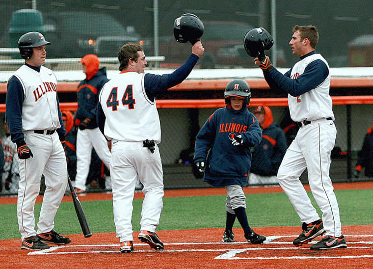 Illinois+Dominic+Altobelli+%282%29+taps+helmets+with+teammate+Casey+McMurray+%2844%29+after+hitting+a+two-run+homerun+against+Michigan+State+on+Sunday%2C+March+29%2C+2009+at+Illinois+Field.+The+Illini+defeated+the+Spartans+3-0.%0A