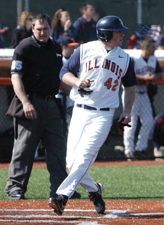 Willie Argo crosses the plate at the Illinis fourth game against Akron at Illinois Field in Urbana, Mar. 15, 2009.
