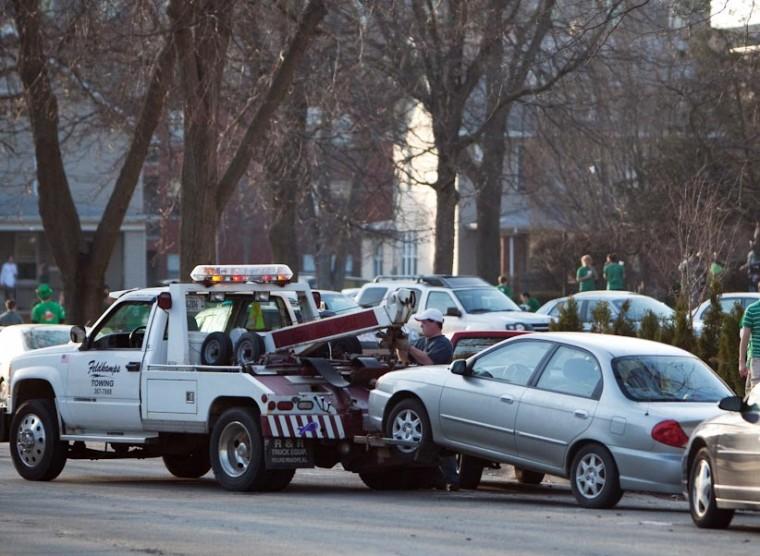 A car is towed on Chalmers street between First and Second streets in Champaign on Friday, March 6, 2009. Dean Santarinala
