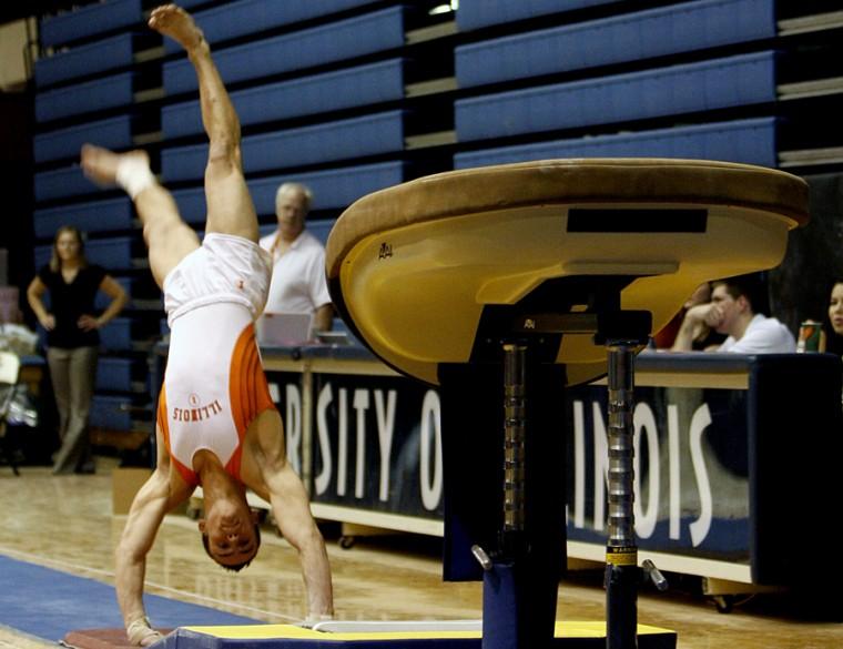Illinois’ Paul Ruggeri performs on the vault at the gymnastics meet at Huff Hall on Jan. 24. The Illinois’ men’s team defeated Ohio State 351.950-349.050.
