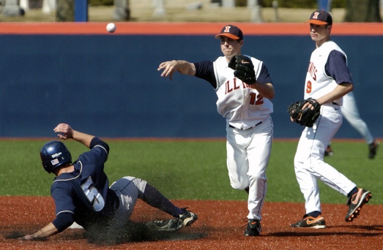 Brandon Wikoff turns a double play Sunday during the Illinis fourth game against Akron at Illinois Field in Urbana.
