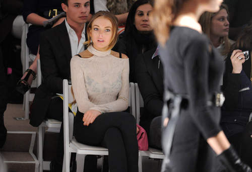 Lindsay Lohan, center, attends the Charlotte Ronson Fall 2009 fashion show at Bryant Park on Feb. 13 in New York. Evan Agostini, The Associated Press

