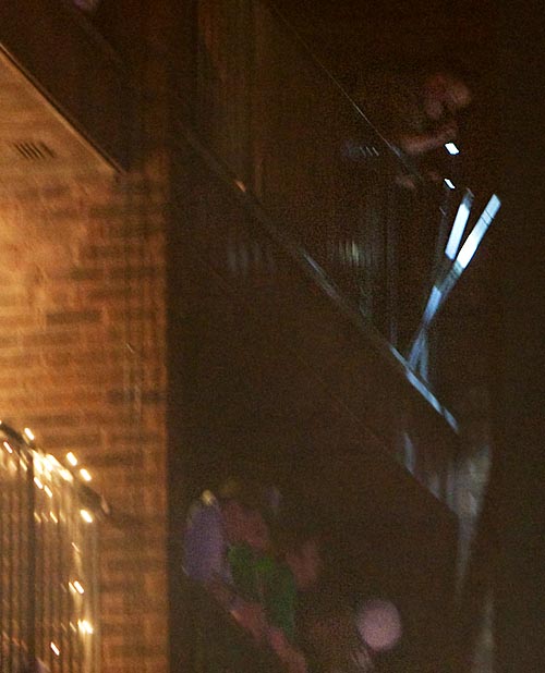 Champaign Police investigate the scene and shine their light on the balcony that gave way. Dean Santarinala
