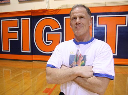 Illini wrestling coach Mark Johnson poses for a portrait in Huff Hall on Wednesday. Coach Johnson was given an Inspirational Award from the Fellowship of Christian Athletes. Ramzi Dreessen
