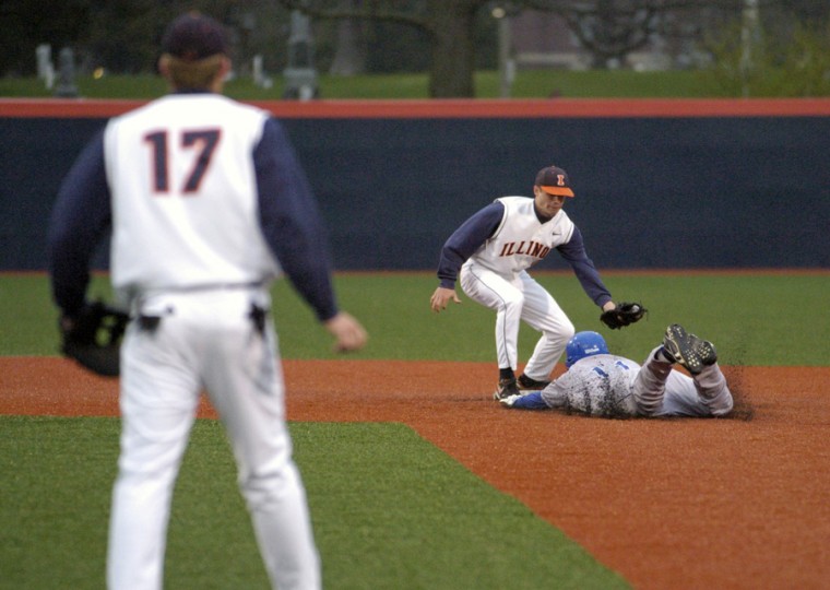 Illinois Josh Parr tags Eastern Illinois Richie Derbak as he slides into second base at Illinois Field on April 14, 2009.
