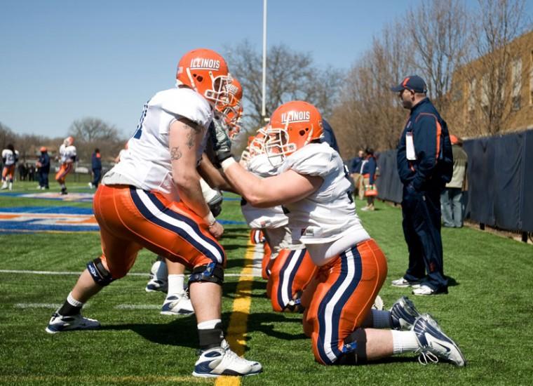 Members of Illinois footballs offensive line perform drills in front of coach Joe Gilbert before a scrimmage at Oak Park-River Forest High School in Oak Park, IL on Saturday, April 11, 2008.
