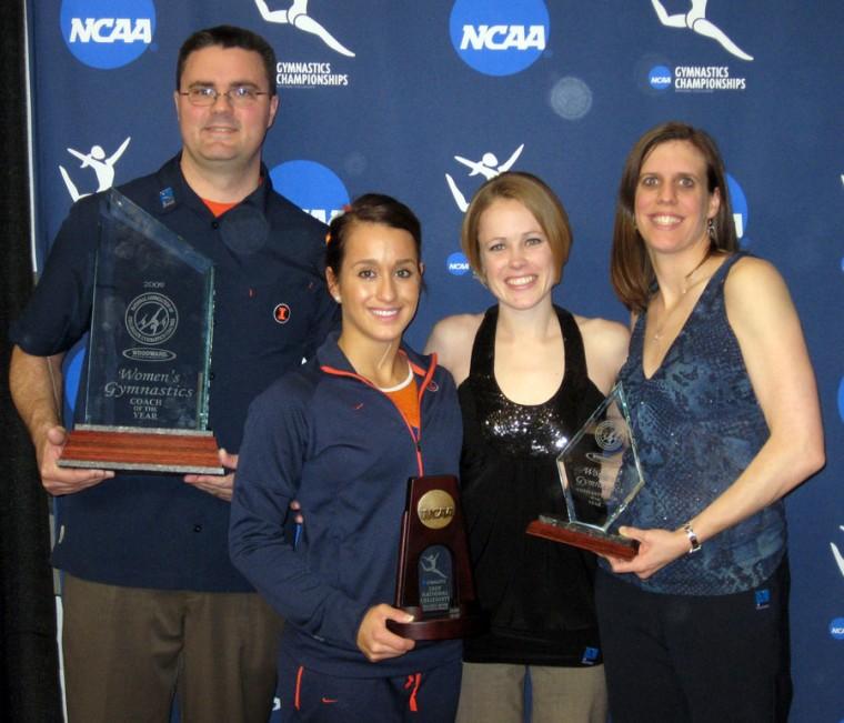 Photo Courtesy of Amy Pyle (Left to right) Women’s gymnastics head coach Bob Starkell, sophomore on the gymnastics team Melissa Fernandez, assistant coach Amy Kruse and associate head coach Kim Landrus, accept awards at the NCAA women’s gymnastics championship on Saturday. Starkell was named national head coach of the year, Kruse and Landrus were named co-assistant coaches of the year, and Fernandez took seventh place in the beam competition.
