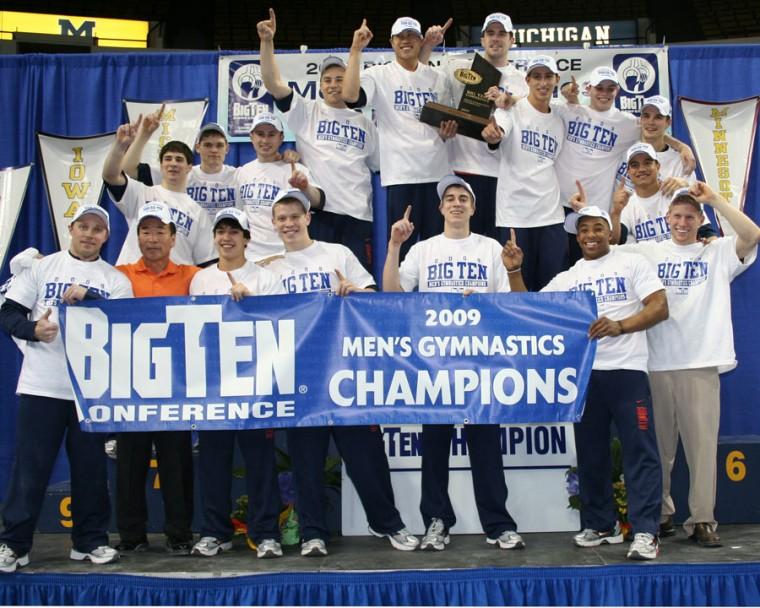 The+Illinois+mens+gymnastics+team+stands+on+the+podium+following+the+Big+Ten+championships+at+the+University+of+Michigan+on+Friday%2C+April+5.%0A