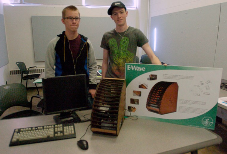 Chris Spiewak, Nick Pulos (not pictured), Terry Coyne, and Jake Krzeczowski (not pictured), all Juniors in Industrial Design, present their model for the eWaste Competition, and will be submitted on April 16th.
