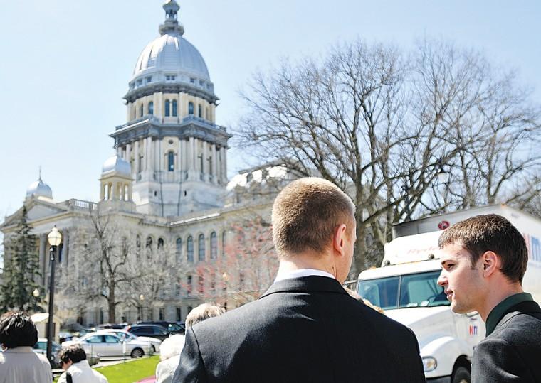 Nick Esterman, left, junior in LAS, and Jeff Schroeder, sophomore in ENG, walk towards the State Capital Building in Springfield on Wednesday, April 1, 2009. Esterman and Schroeder were part of the delegation visiting lawmakers to lobby as part of University of Illinois Day.
