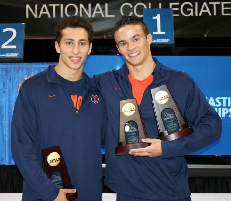 Photo Courtesy of Illinois division of Athletics Illinois’ Daniel Ribeiro (left) won the pommel horse event at the NCAA national gymnastics championships. His teammate Paul Ruggeri (right) took first in both parallel bars and high bar competitions. Both were named All-Americans in their events. Roger Pasek also earned All-American honors.
