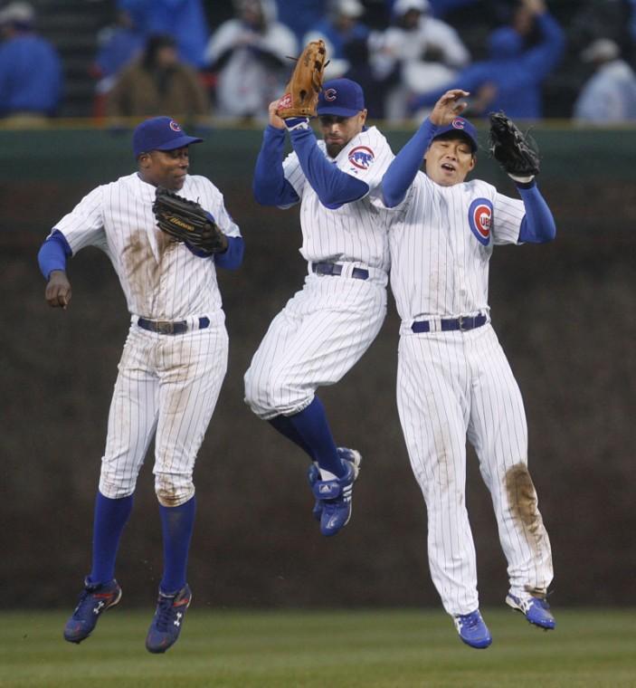Chicago Cubs outfielders, from left, Alfonso Soriano, Reed Johnson, and Kosuke Fukudome, celebrate the Cubs’ 4-0 win over the Colorado Rockies at Wrigley Field in Chicago on Monday.
