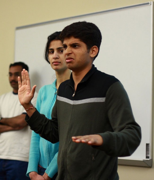 Suraj Nellikar (Right), a graduate student in engineering and a member of the Mithya performance group, practices the part of Obama on Monday evening at a rehearsal for a play which he and his group will be present on India Night.
