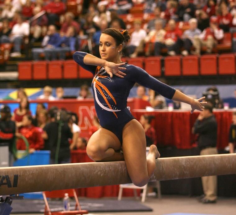 Illinois Melissa Fernandez performs on the balance beam at the NCAA Championships. Fernandez scored a 9.900 and advanced to Saturdays individual event finals. By making it to the event finals she earned First Team All-America honors, becoming the first Illini in school history to do so.
