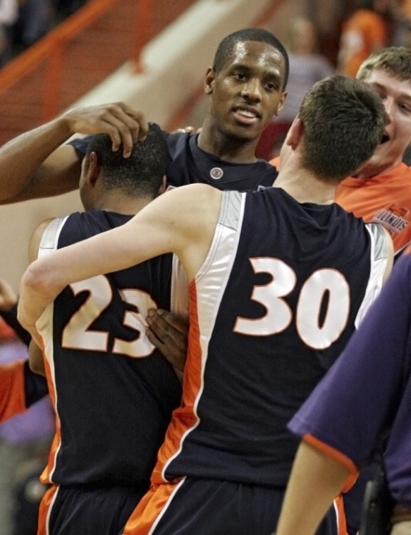 Illinois forward Mike Davis, back, the leading scorer, is congratulated by teammates Dominique Keller, left and Bill Cole, right, after Illinois 76-74 victory over Clemson in an NCAA college basketball game, Wednesday, Dec. 2, 2009, at Littlejohn Colliseum, in Clemson, S.C.
