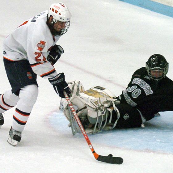 Illinois JJ Heredia (21) attempts to score a goal against Western Michigans Riley Gill (30) during Fridays game at the Ice Arena on Oct. 23, 2009. Illinois won 5-0.

