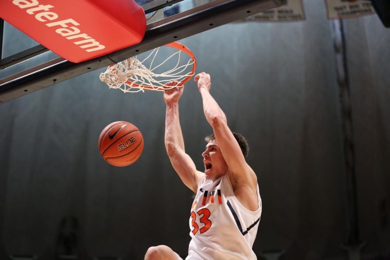 Illinois Jon Ekey dunks the ball off a missed shot during the game against Bradley at State Farm Center, on Sunday. The Illini won 81-55.