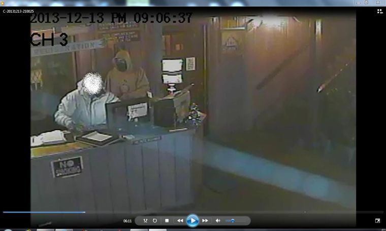 A still picture from the surveillance video of an armed robbery at the Lincoln Lodge Motel, 403 West University Ave. at around 9 p.m. on Dec. 13.