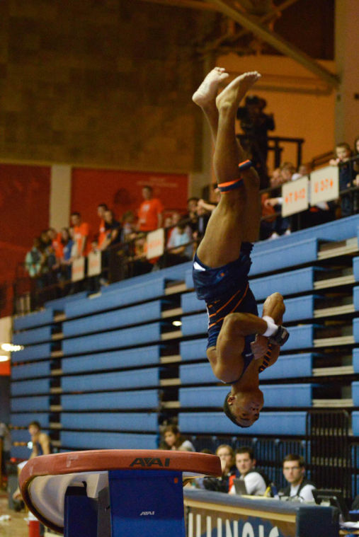 Fred Hartville performs the vault routine against Ohio State at Huff Hall on Sunday, Jan. 26rd, 2014.
