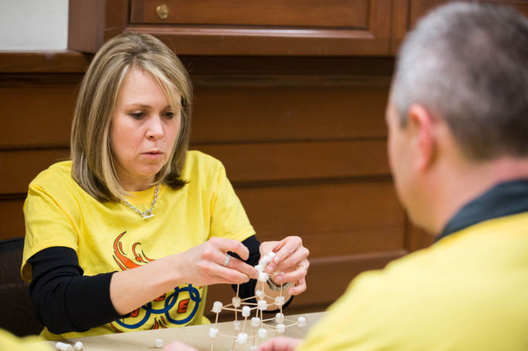 Angie Wolters, the Assistant Director of Women in Engineering, is building Olympic themed marshmallow tower in EWEEK on Feb 19.