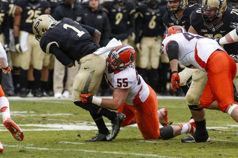 Illinois Houston Bates (55) tackles Purdues Akeem Hunt (7) during the game at Ross-Ade Stadium in West Lafayette, Ind. on Saturday, Nov. 23, 2013. The Illini won, 20-16.