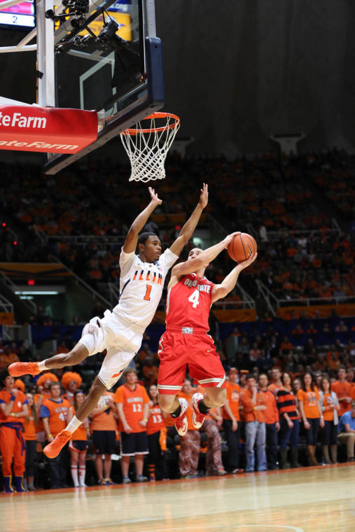Illinois Jaylon Tate (1) attempts to block Ohio States Aaron Craft (4) during the game against No. 22 Ohio State at State Farm Center on Saturday, Feb. 15. The Illini lost 48-39.