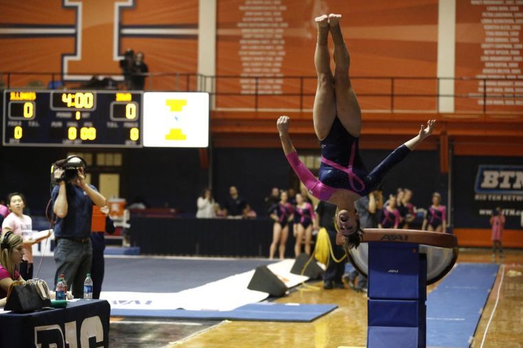 Illinois’ Giana O’Connor competes her vault pass during a dual meet against Iowa at Huff Hall on Friday. O’Connor placed third with a score of 9.800, and Illinois defeated Iowa.
